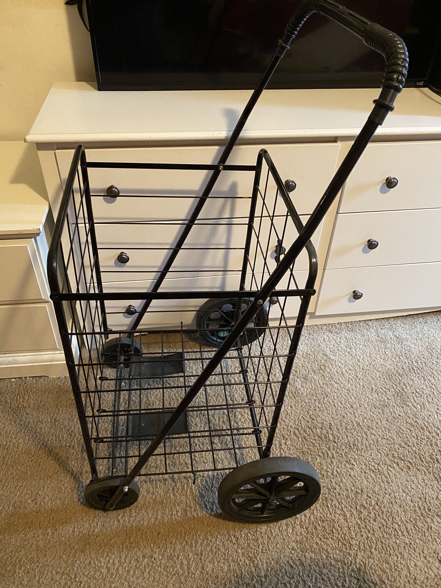 Shopping cart with wheels black used in good condition