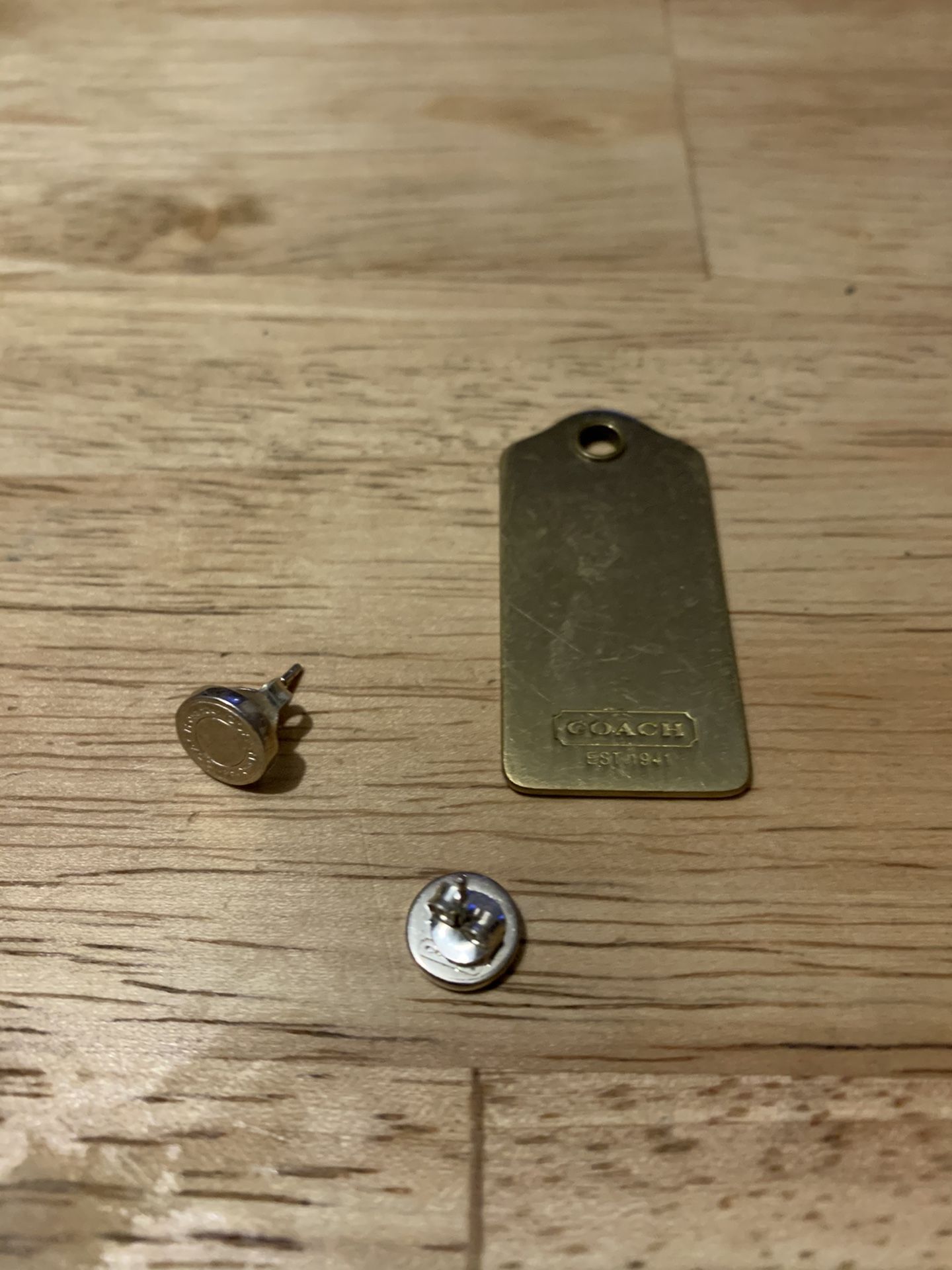Coach silver circle earrings and Coach tag