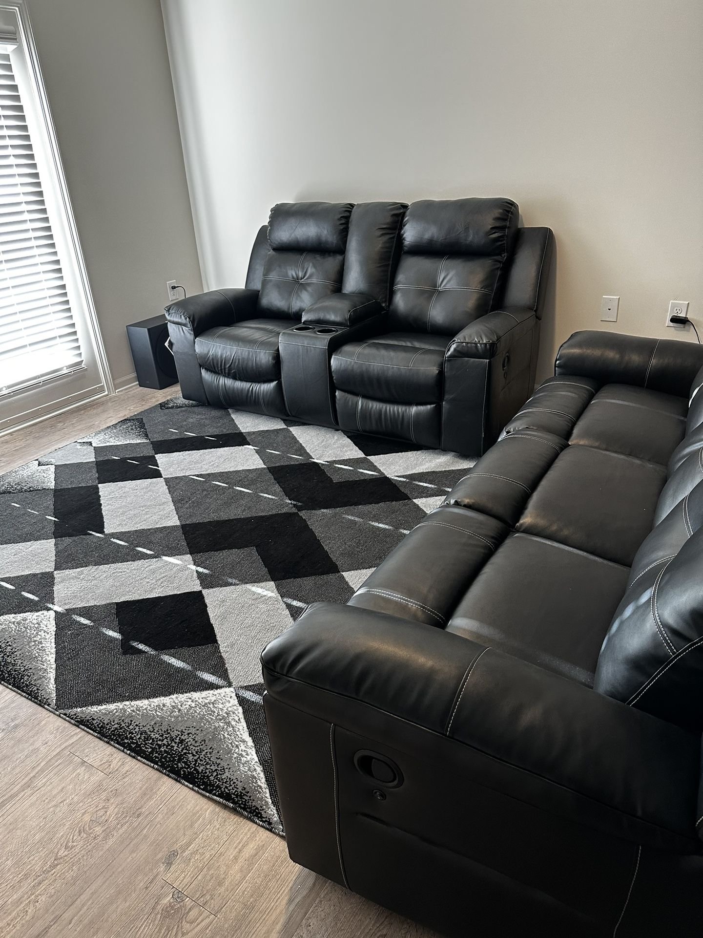 Like new - Reclining leather Couch With Matching Rug With Warranty