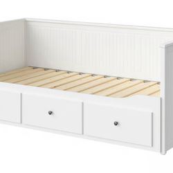 IKEA white daybed/trundle featuring three storage drawers