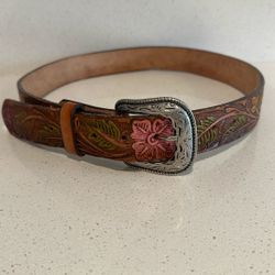 handmade leather belt with embossed roses in a Western cowgirl style