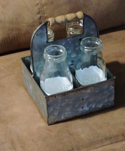 Metal Carrier With 4 Dairy Bottles