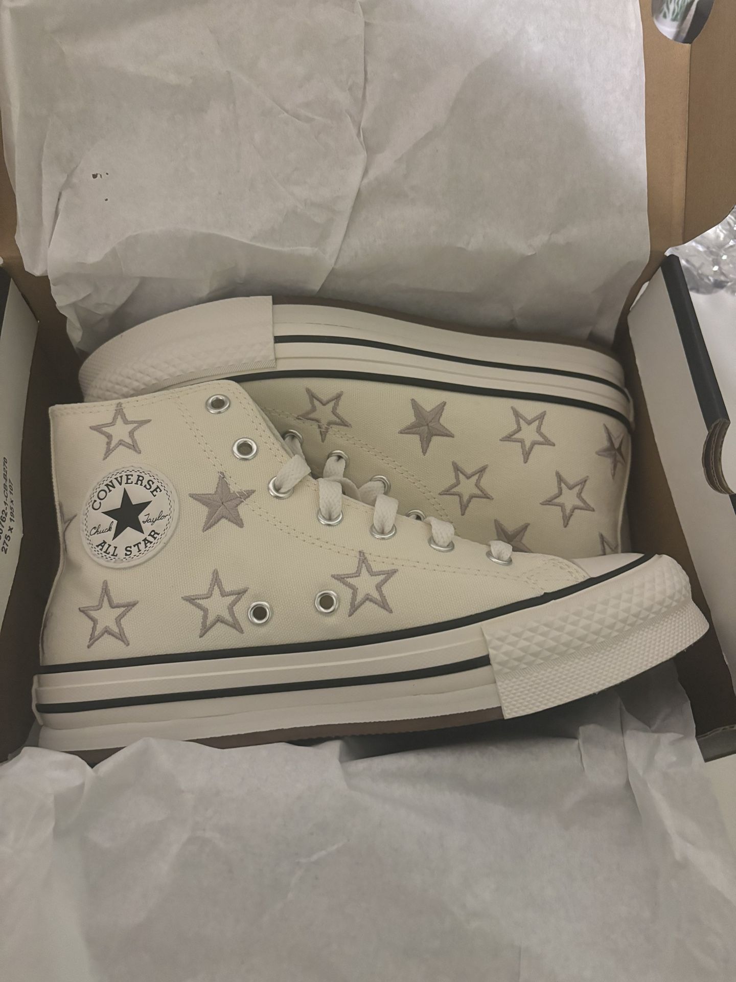 Cream and white Converse All Stars high top