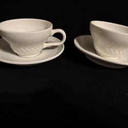 2 Sets Of White Teacups With Saucers