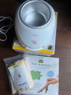 Gigi wax warmer with sticks and sheets