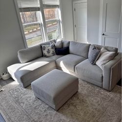 Light grey sectional with ottoman