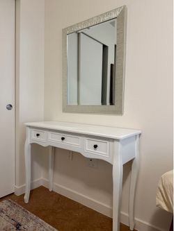 White vanity with mirror
