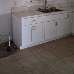 cabinets with marble tops plus sink