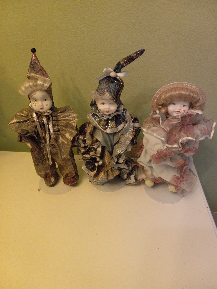 Set Of Three Clowns  Figurines With Stand And Porcelain Face