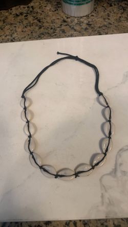 Necklace Cowrie Choker glossy Shells threaded onti a black cord Jewelry