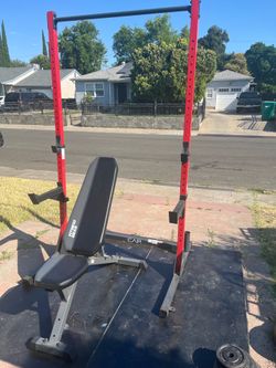 Squat rack with multiple position bench