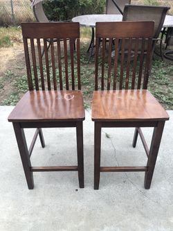 Two wooden barstools