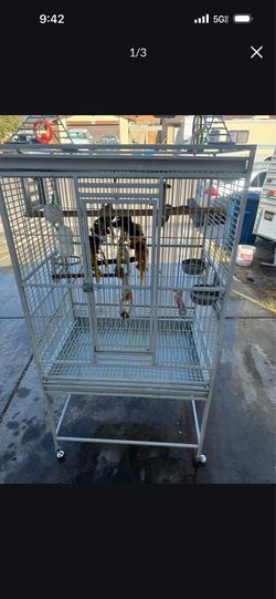 Large bird cage with play area stand