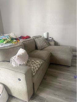 Beige pull out couch w/ storage