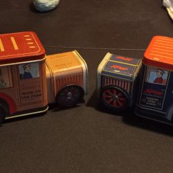 Nostalgic Hershey's and Kellogg's branded tin toy delivery trucks.