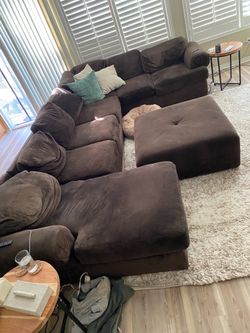 Brown sectional with large ottoman.