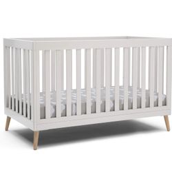 Delta Children Essex 4-in-1 Convertible Baby Crib, Bianca White with Natural Legs