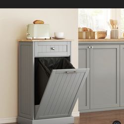Brand new tilt out trash can, laundry, or storage cabinet with drawer