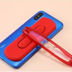 Rent folding reading glasses attachable to rear of cell phone