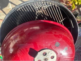 Red clean BBQ ready for cook 23 inch diameter.