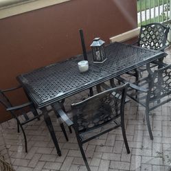 Patio metal table and chairs plus umbrella stand