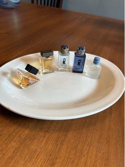 Perfume Bottles - Miniature 4 Dolce & Gabbana - 1 Prada. Some slightly tested. They are about 6 months sitting around. Collectible miniatures!