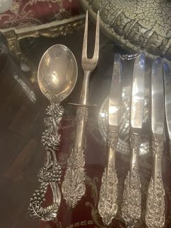 set of sterling silver plated designer silverware.