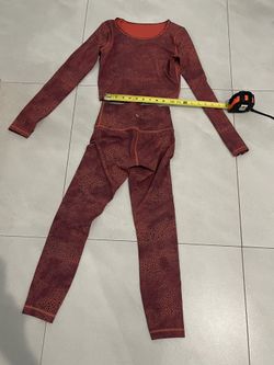 Size 4 Lululemon Wunder Train cropped long-sleeve shirt and matching leggings in a crackle glaze red