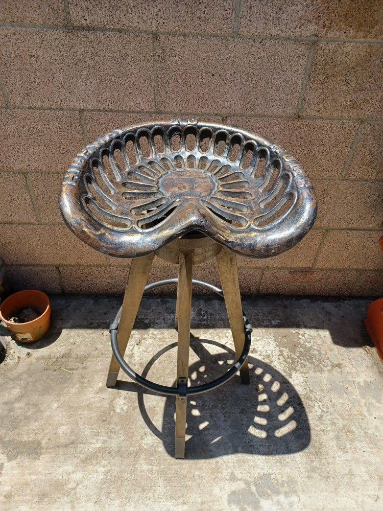 HEAVY DUTY SWIVEL Iron and Wood Vintage Tractor Bar Stool (1) 33 inches tall and the seat is 18 inches wide. Fun decor.