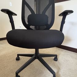 Near-new black office chair. Armrests are adjustable, and it has a rolling base. Great for home office setup.o48
