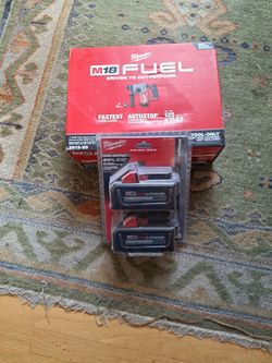Milwaukee M18 Hammer Drill # 2912- 20 And 2 Pack 6.0 Batteries New Never Used 350$ FIRM NO OFFERS