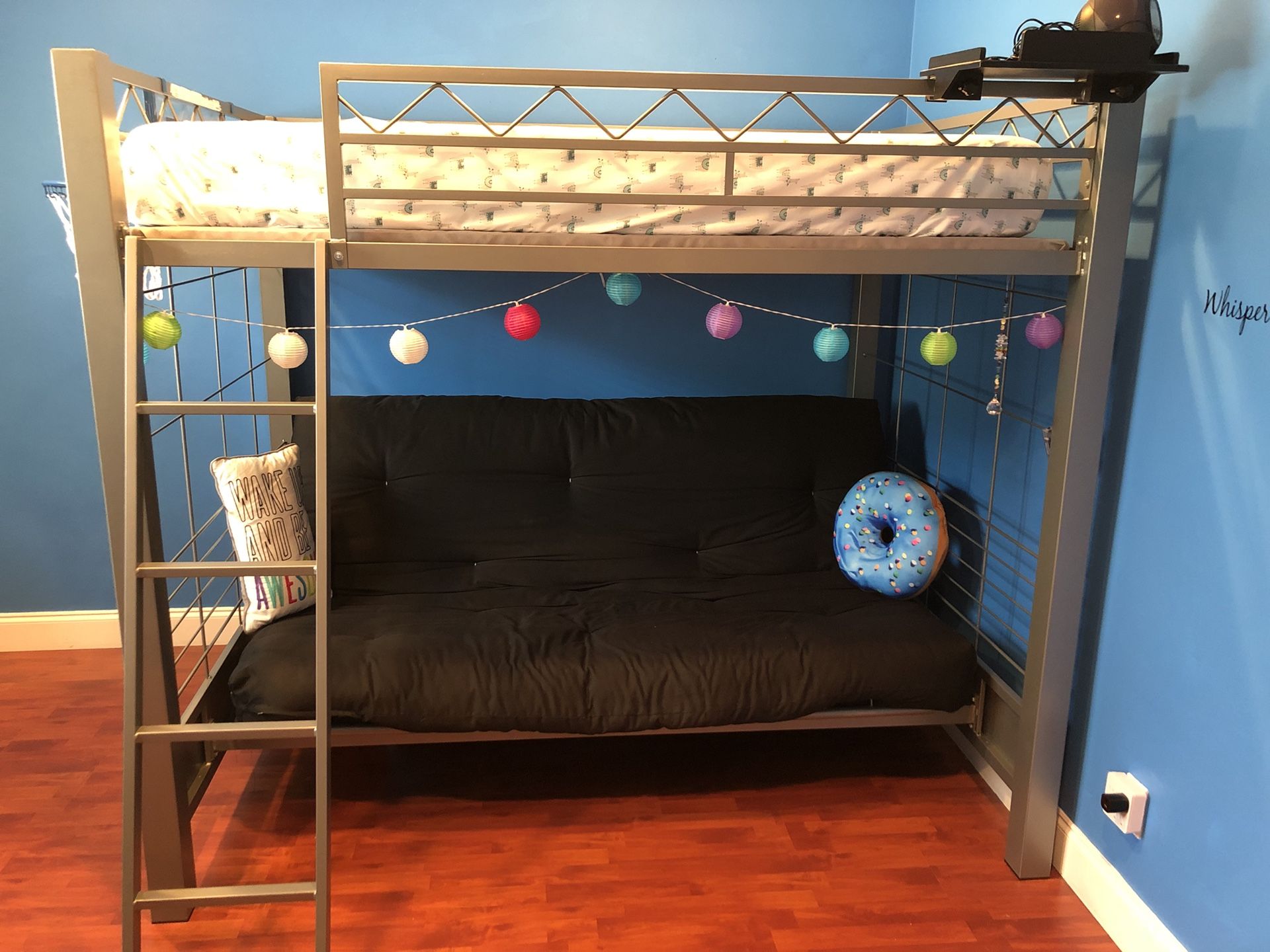 Bunk bed with full mattress on top and full futon below that folds down into bed. 8 months old.