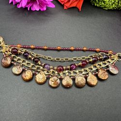 7” Multi strand’s artisan bracelet made of AAA grade perl mixed with different types of chains. 