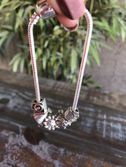 Beautiful Lucky charm bracelet with 5 charms , new never used except the model for try.