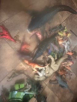 Toy dinosaurs and track with car