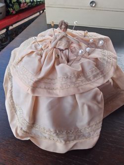 Vintage porcelain doll pin cushion