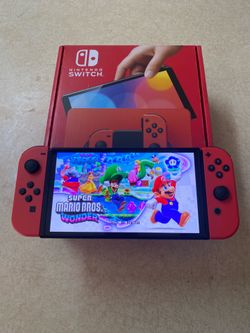 NINTENDO SWITCH OLED + 125 SWITCH GAMES