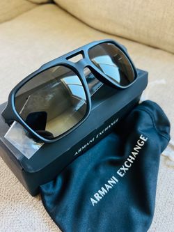 Armani Exchange sunglasses in a matte black rectangular frame with gold-tone hinges