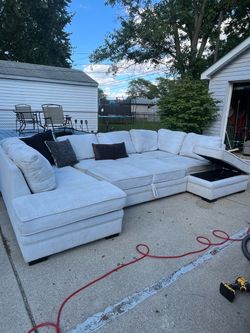 Large Light Gray U-Shaped Sectional with Pull-Out Bed & Storage Ottomans – Delivery Available