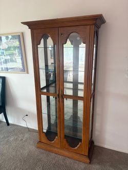 Traditional Wood and Glass Curio Cabinet with Arched Doors