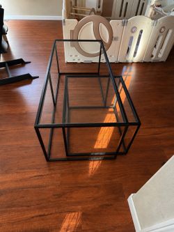 Glass and black steel coffee table