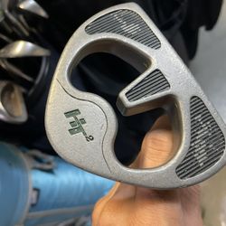 Affinity golf putter in right hand