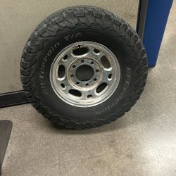 One 8 Lug GM Wheel+Tire