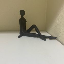 Solid Metal Lady Sitting Down Paperweight.