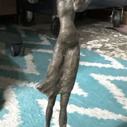 Vintage bronze flute player