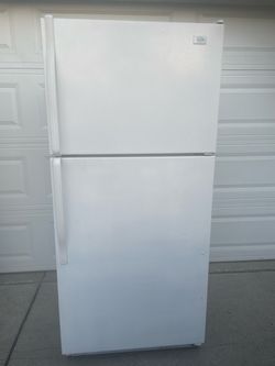 Roper top and bottom refrigerator for $150. Dimensions are 30Wx29Dx66H. Missing bottom drawers. Pick up only.