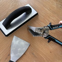 Grout trowel, trim tool and 4inch patty nite.