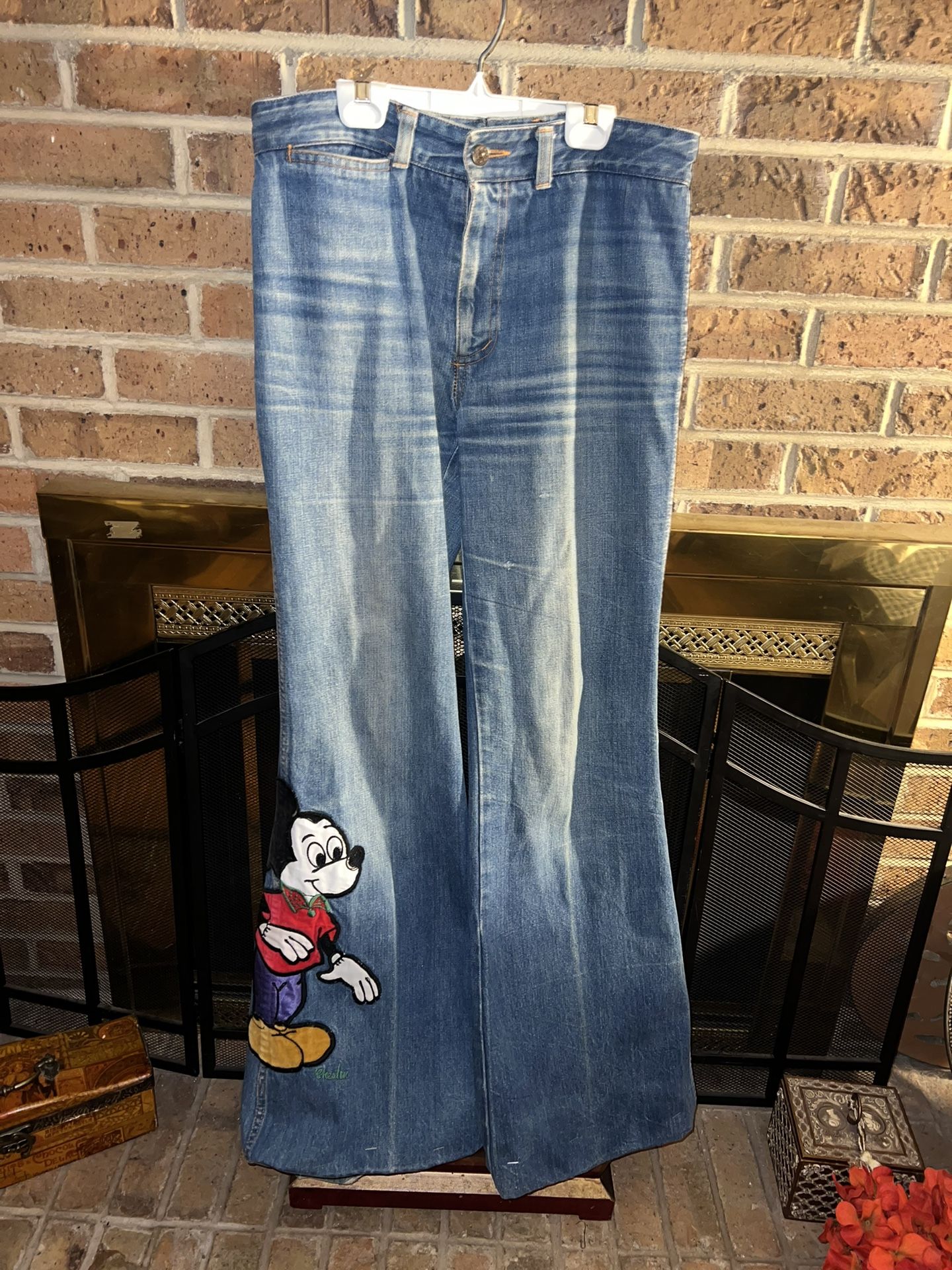 Mickey Mouse 27” long patch on bottom of fun flare wide bottom 33” waist jeans 