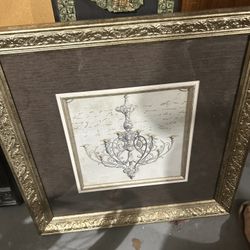 framed print of a chandelier, possibly titled "Chand 2" by the artist Color Bakery