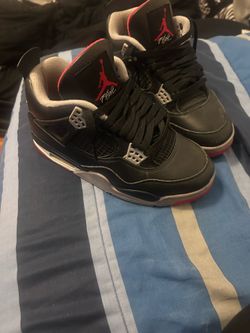 Jordan 4 Retro sneakers in a black, red, and gray size 5 woman